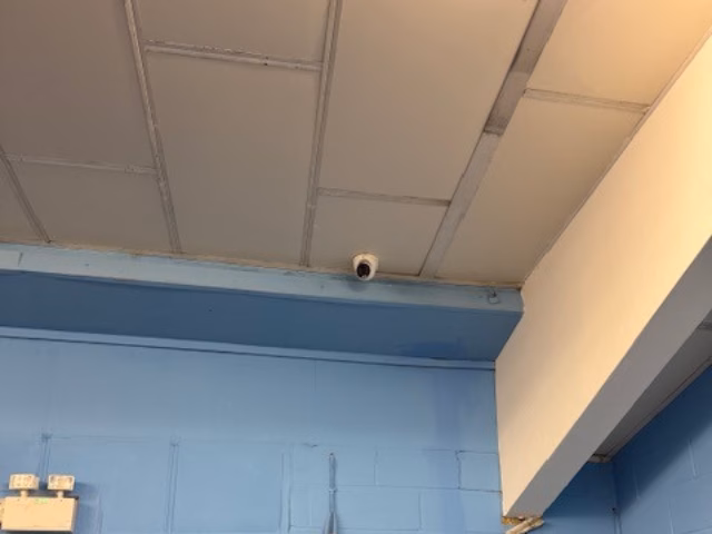 Ceiling camera in the corner of a training area