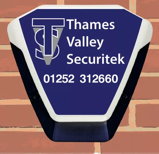 Thames Valley Securitek alarm bell box with siren and strobe on a brick wall