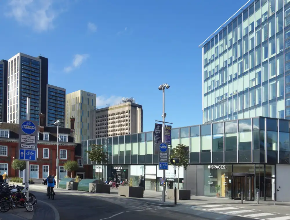 Woking town centre with apartment towers and glass-fronted office buildings